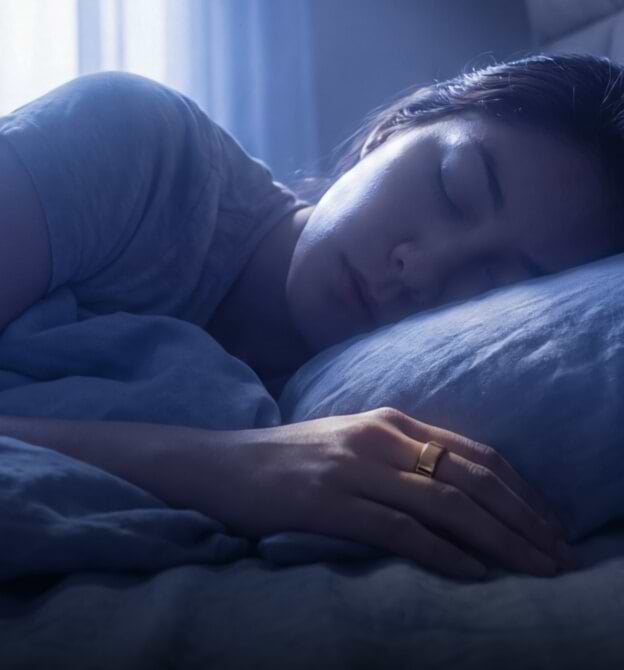 A person asleep wearing an Ultrahuman ring