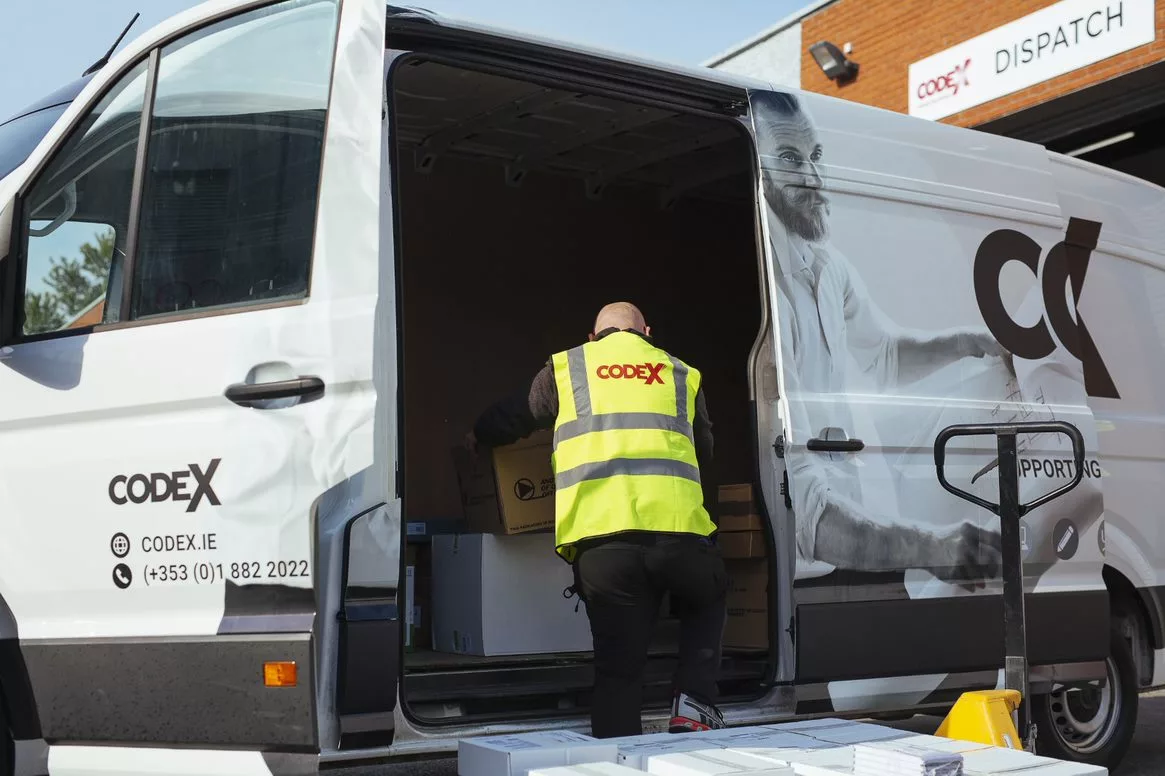 logistics-worker-loading-delivery-van