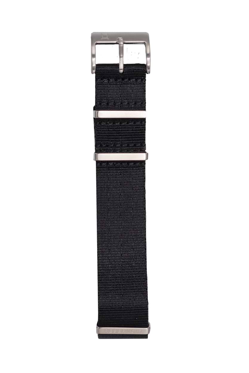 Media editorial of luxury RESERVOIR watch with dark charcoal, light greyish blue, and light grey colors.
