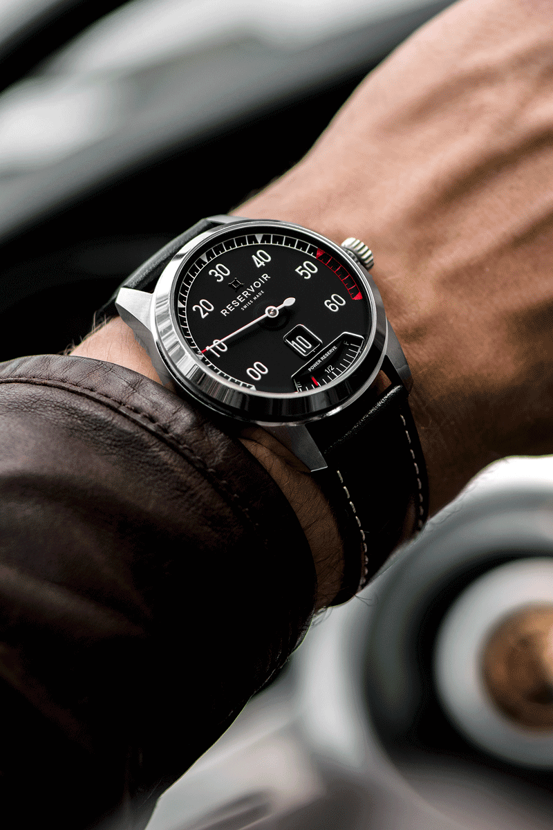 Vintage car with dark brown, light beige, and light grey RPM counter and watch, a symbol of luxury.