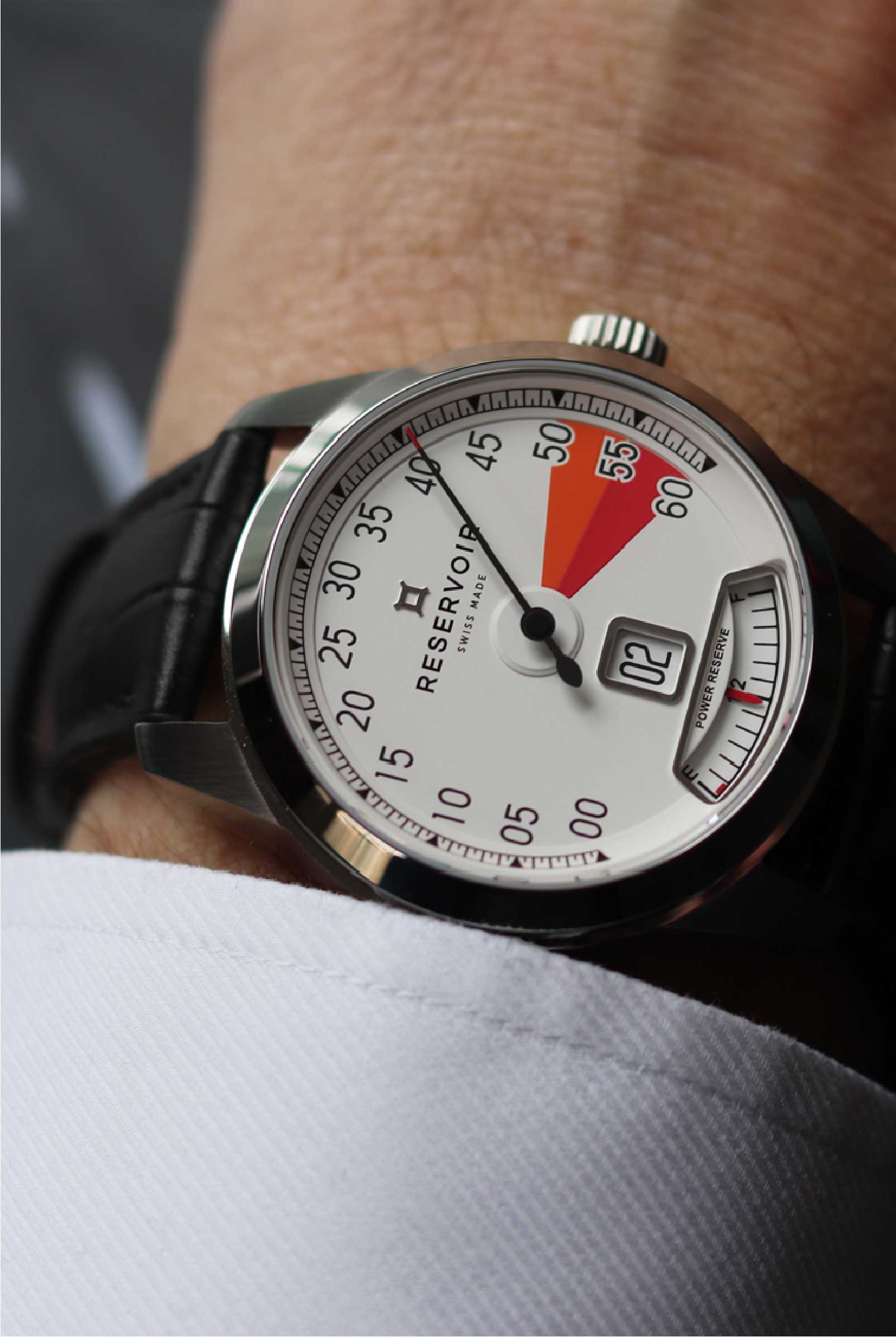 Vintage car rpm counter, black and dark brown watch, luxury light taupe details.
