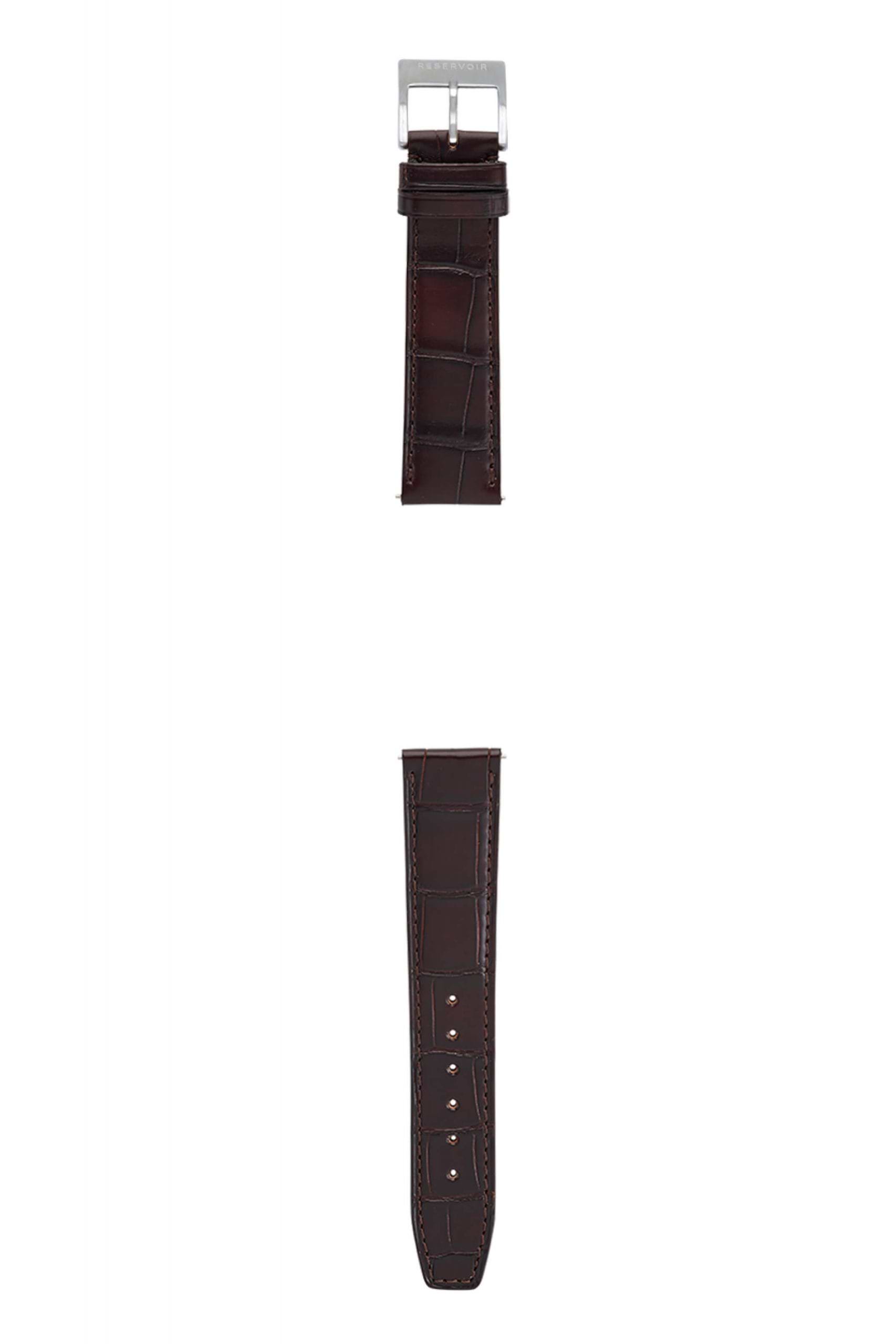 Brown watch strap with a metal buckle and multiple adjustment holes, featuring edge stitching.
