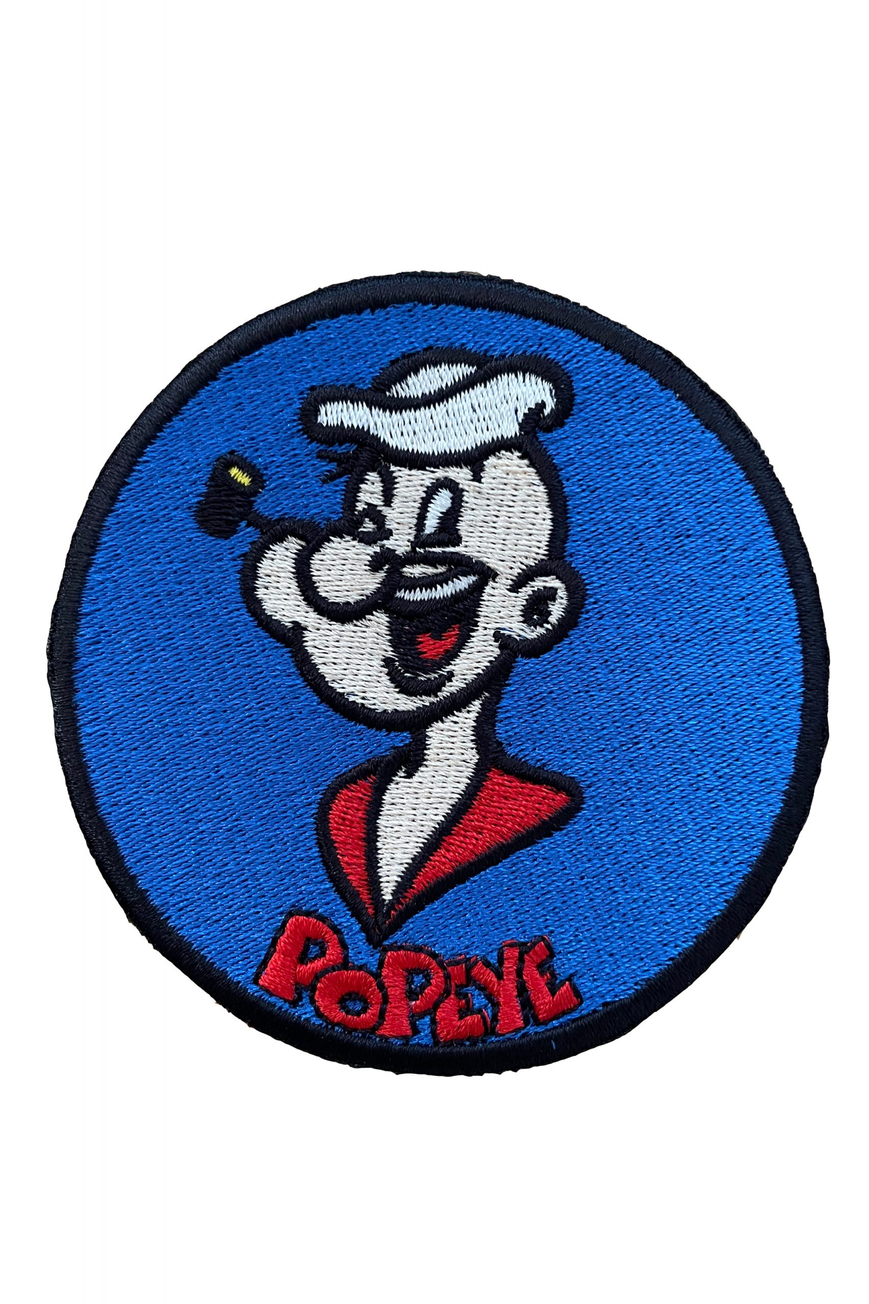 Popeye comic character in navy blue, mauve, and sky blue.
