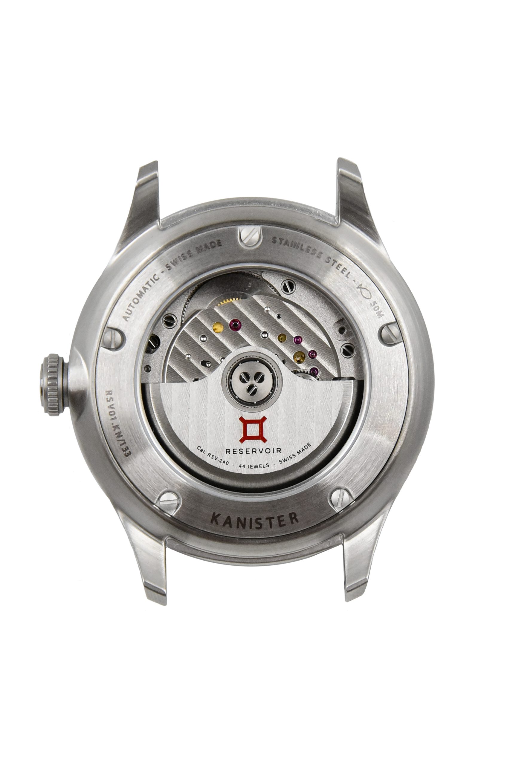 Back view of Reservoir Kanister watch case, showing automatic movement and "Swiss Made" markings.