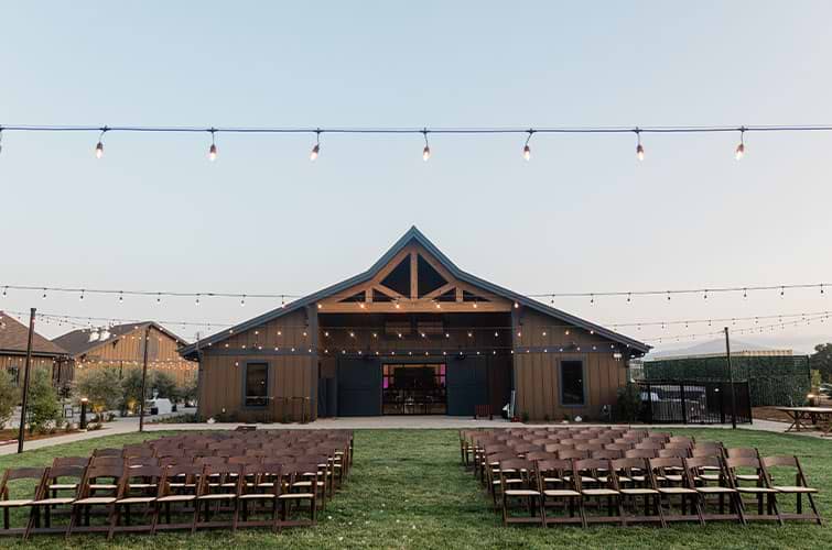 Outdoor ceremony site with the modern barn at Canopy Grove