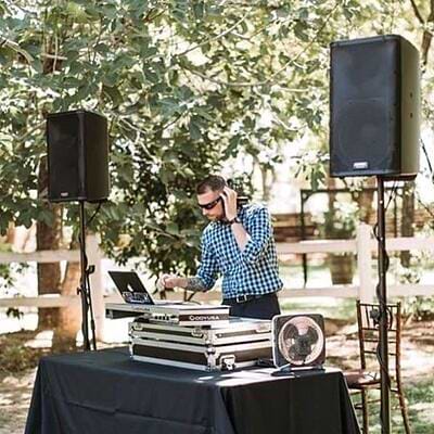 A wedding DJ is essential to create atmosphere . . . and fun