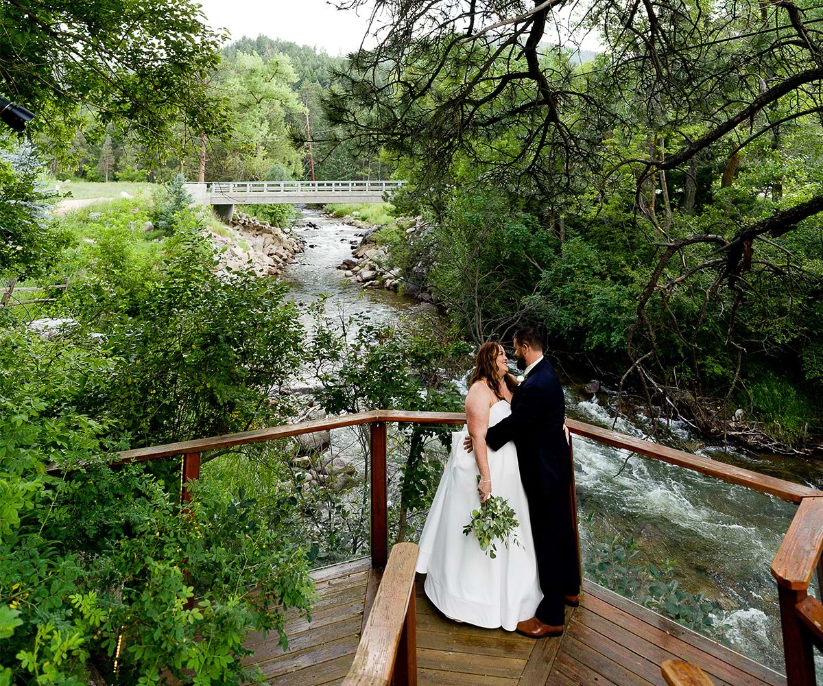 A couple by the creek at Boulder Creek by Wedgewood Weddings