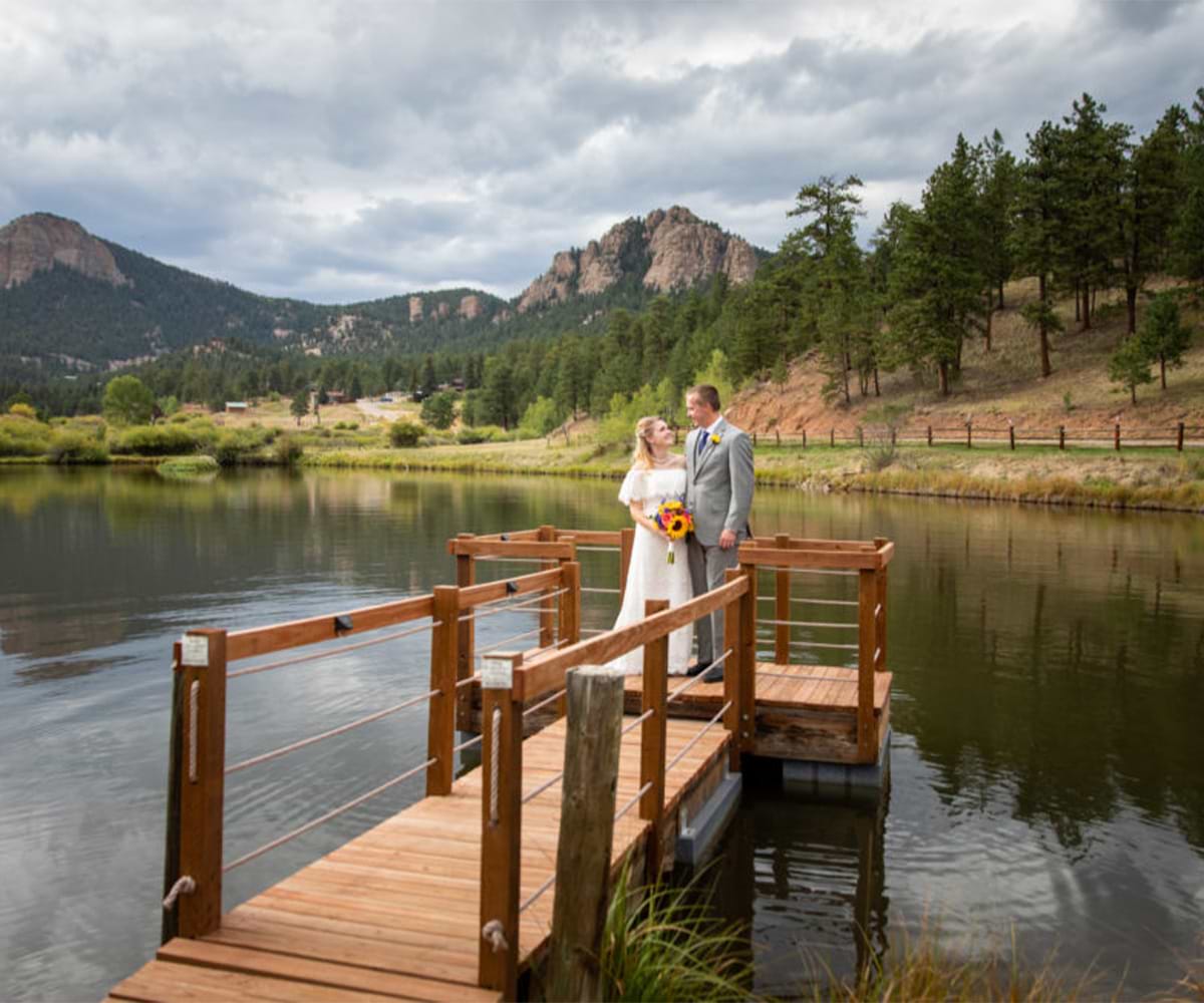A couple by the lake at Mountain View Ranch by Wedgwood Weddings