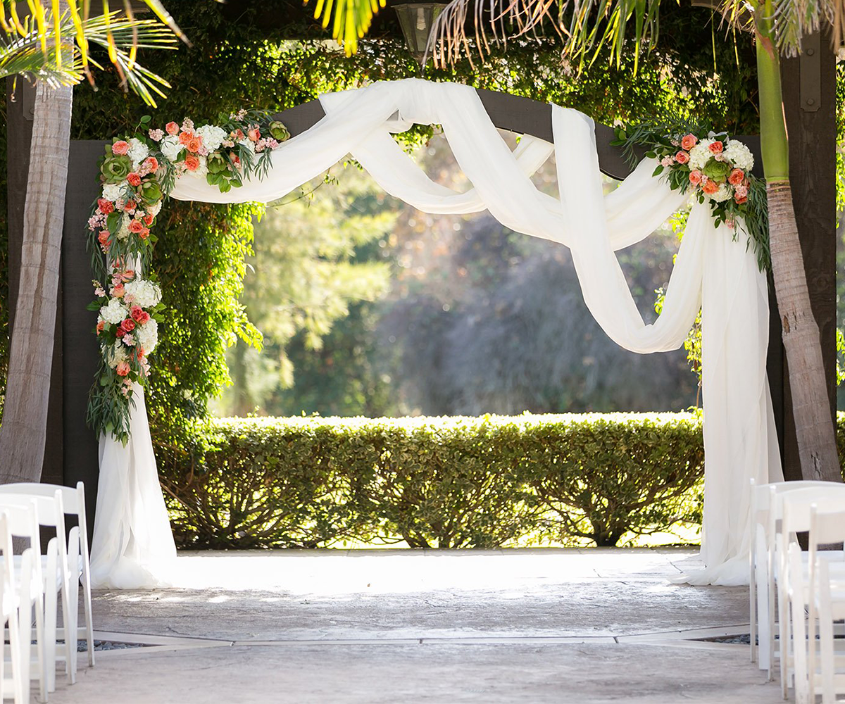 MIXED DRAPING AND BRIGHT FLORALS CREATE A SHOWSTOPPING SWAGGED ARCH  - Fallbrook Estate by Wedgewood Weddings