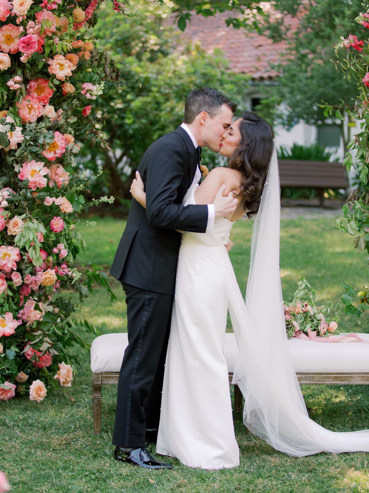 Bride and groom sharing their first kiss as husband and wife