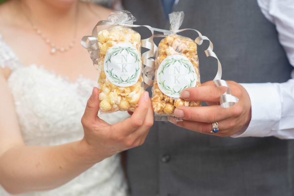 Bride and groom holding DIY favors