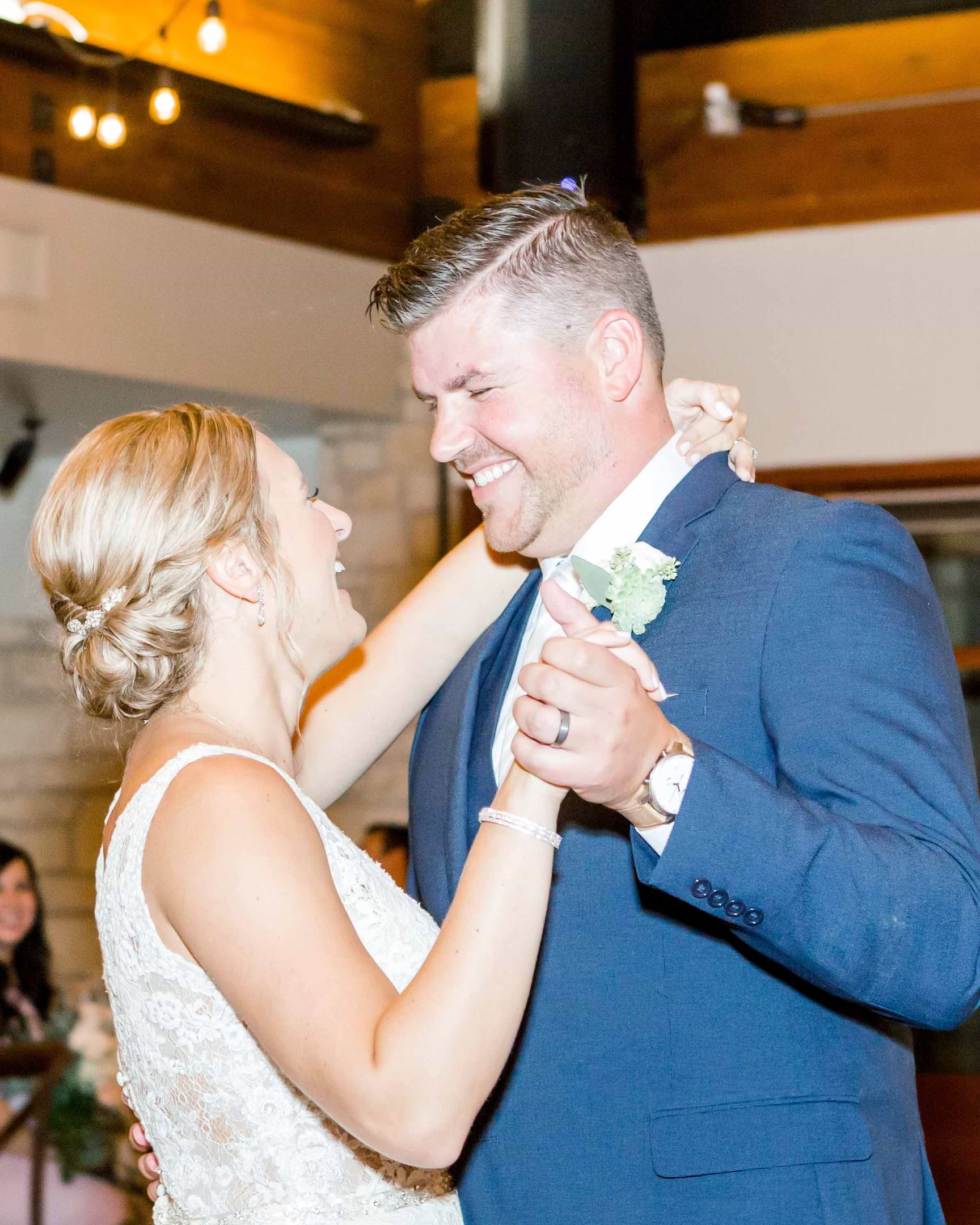 The Happy Couple Shares A Sweet First Dance In The Glowing Ballroom