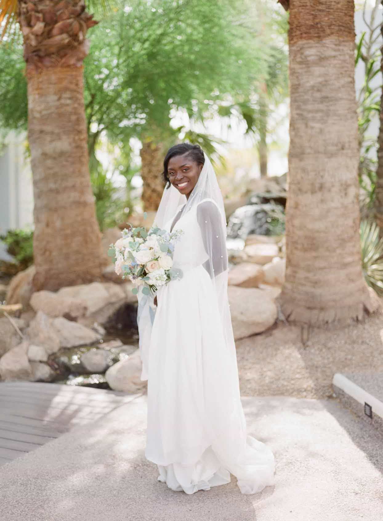 Enyo Looked Stunning In A Simple White Wedding Gown With Pearl-Accented Belt and Veil