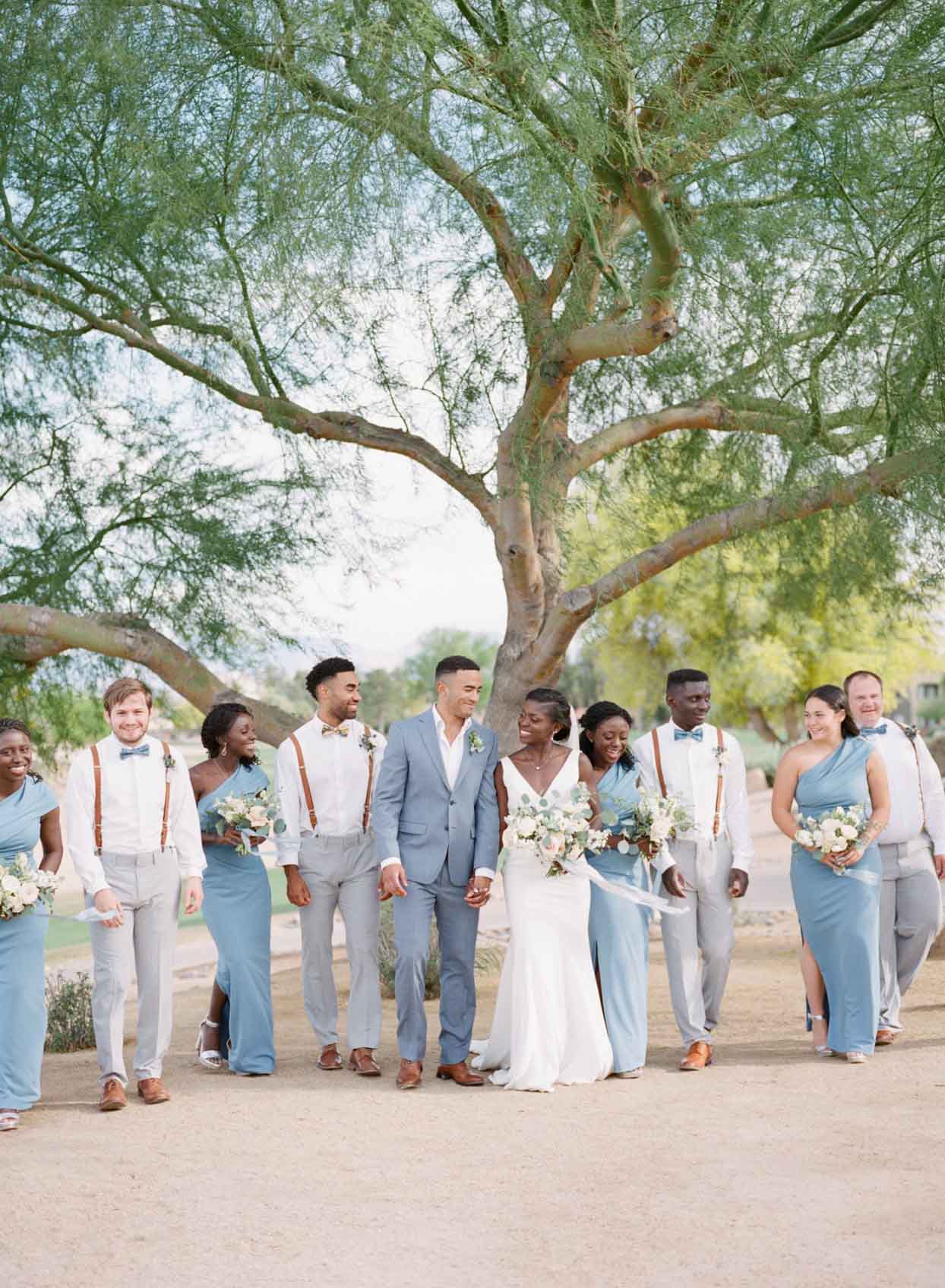 Charming Wedding Party Walks Across The Desert Grounds at Palm Valley in Goodyear, AZ