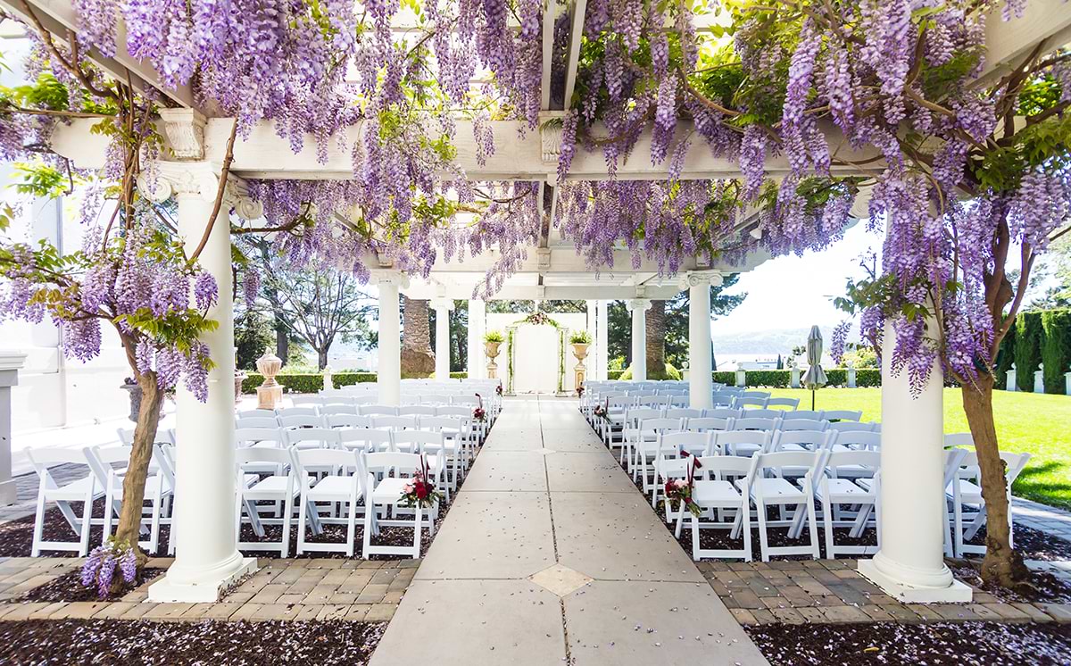 Jefferson Street Mansion is an outdoor wedding venue with a wisteria-draped veranda for wedding ceremonies