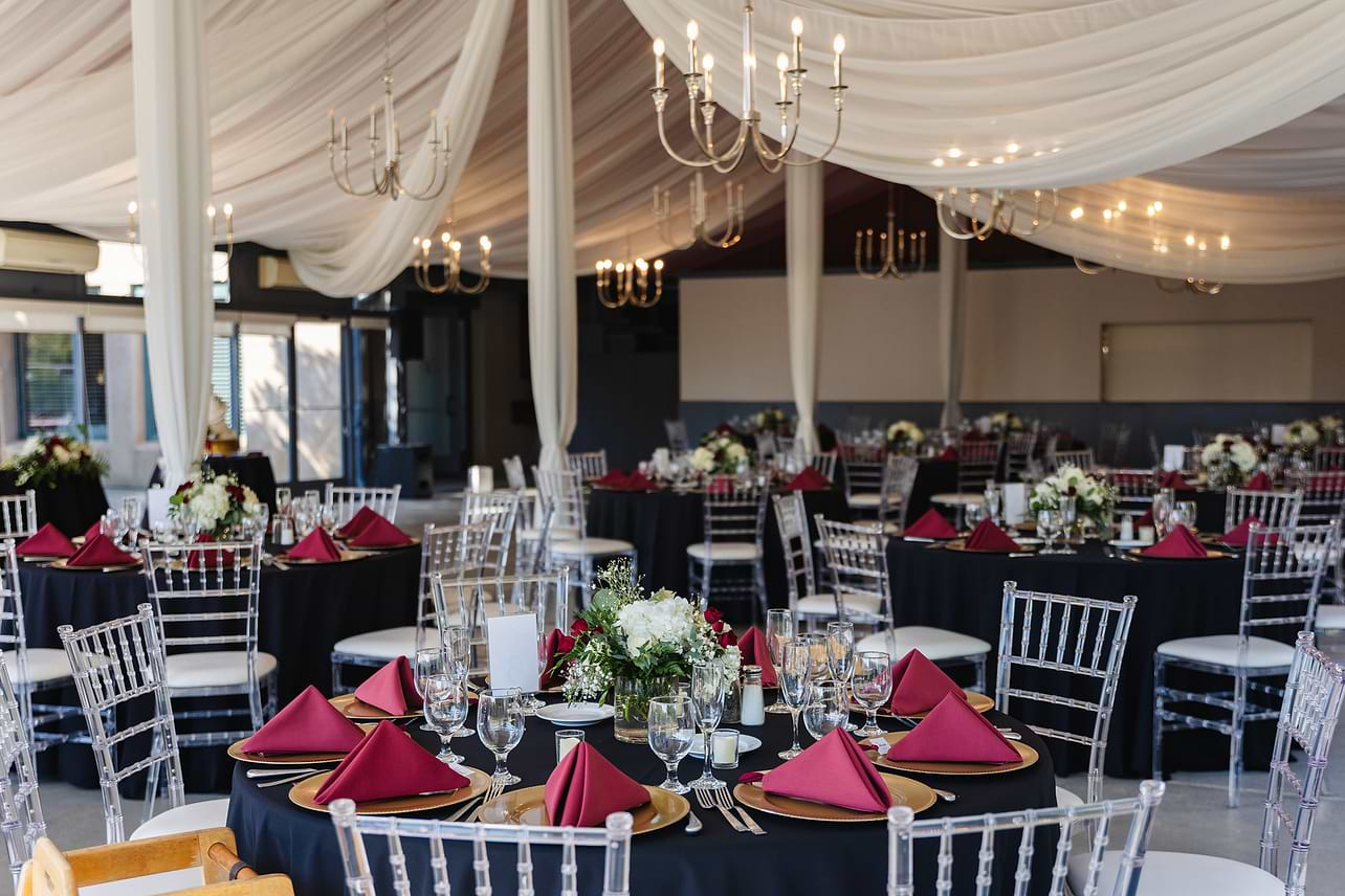 Beautiful grand hall with burgundy accents at Hiddenbrooke Hills by Wedgewood Weddings