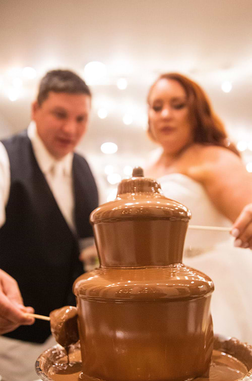 Bride and groom enjoying chocolate fountain - Boulder Creek by Wedgewood Weddings
