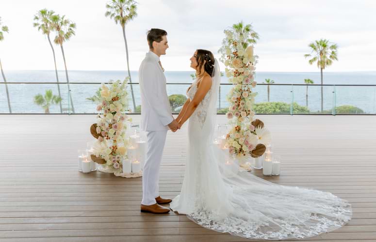 Bride and groom similing at altar - La Jolla Cove Rooftop by Wedgewood Weddings - 1