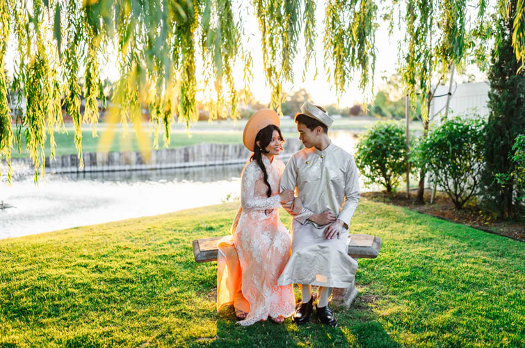 Bride and groom posing in front of pond - San Ramon Waters by Wedgewood Weddings