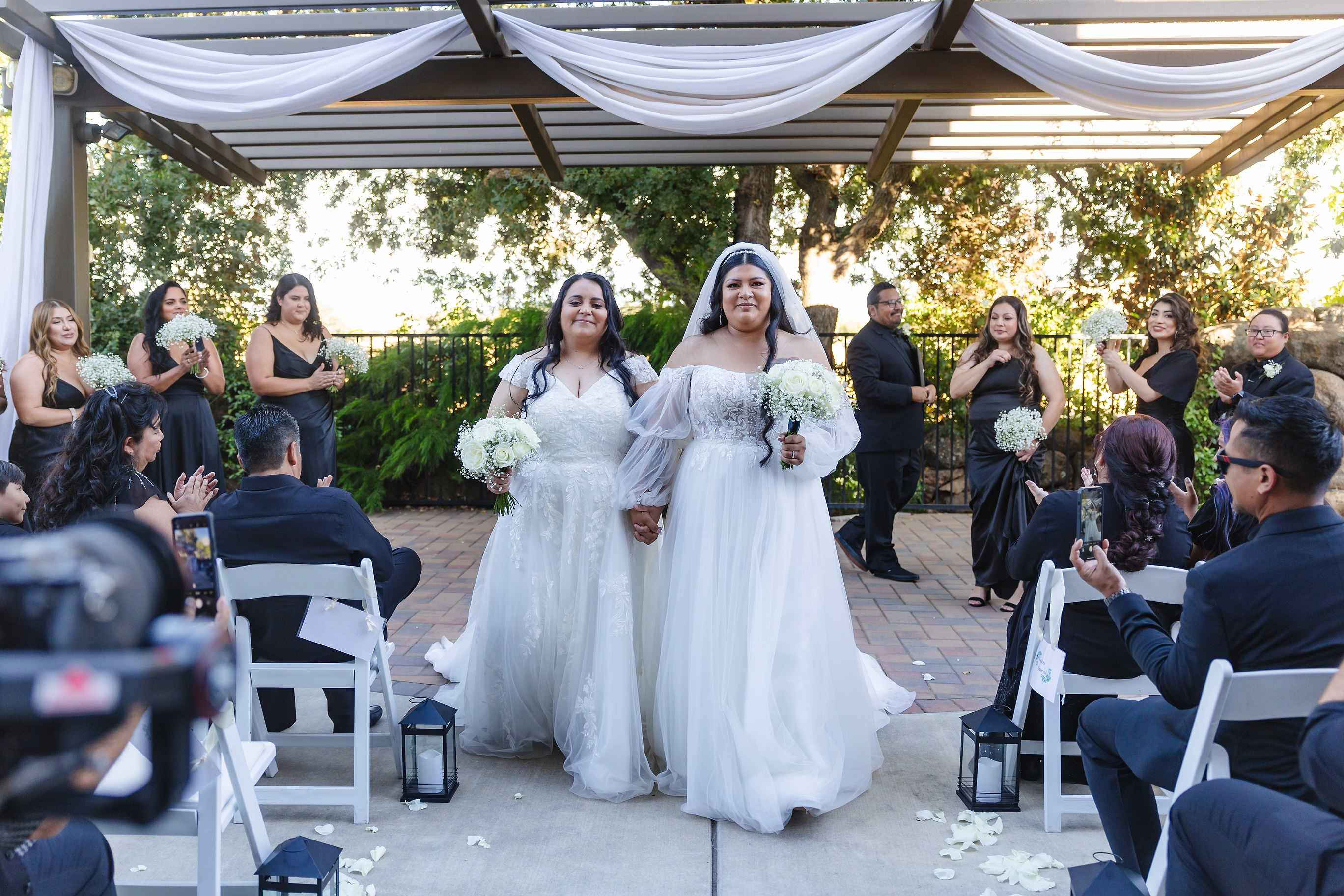 Brides walking down the aisle - Evergreen Springs by Wedgewood Weddings