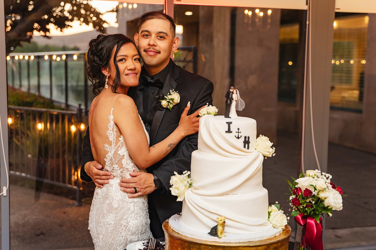 Couple by cake at Hiddenbrooke Hills by Wedgewood Weddings