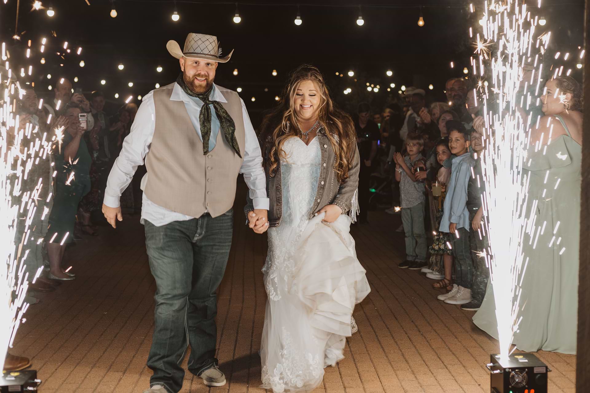 Couple enjoying grand sparkler moment for grand entrance at Hofmann Ranch by Wedgewood Weddings