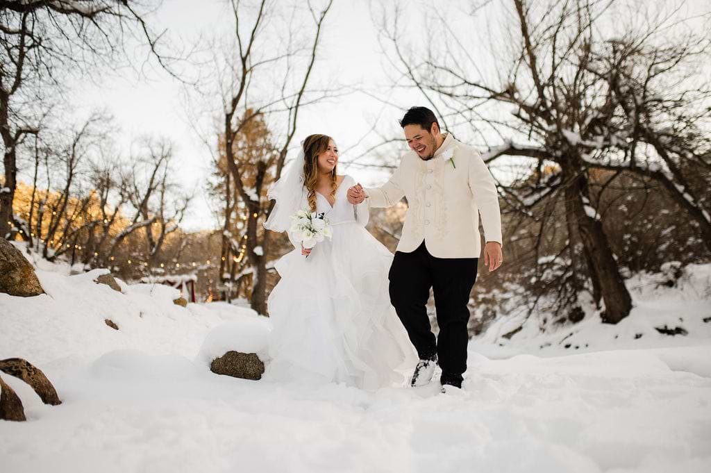 Couple frolicking in the snow - Boulder Creek by Wedgewood Weddings