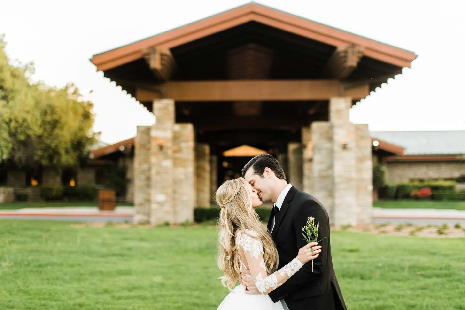 Couple in front of building at Dove Canyon by Wedgewood Weddings