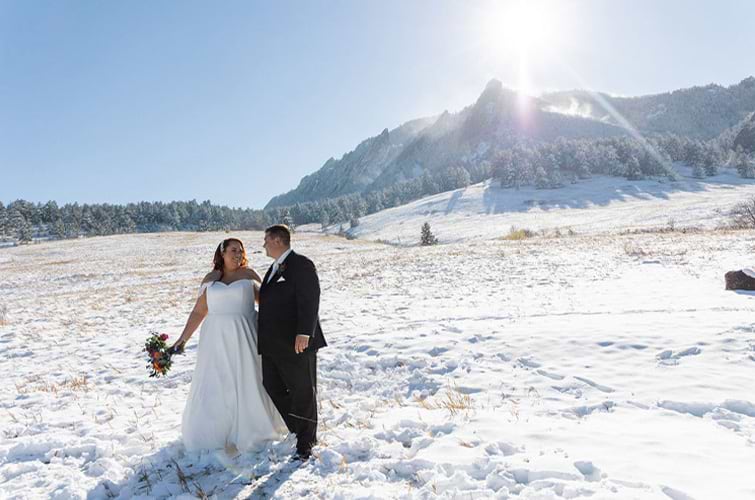 Couple in snow with gorgeous mountain backdrop - Boulder Creek by Wedgewood Weddings