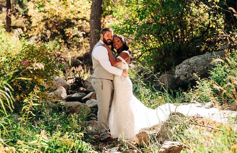 Couple posing by greenery and meadow - Boulder Creek by Wedgewood Weddings