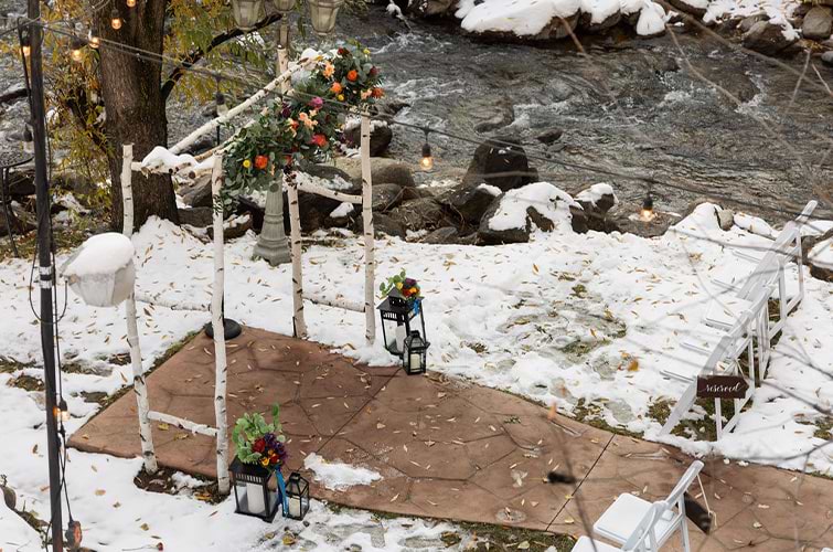 Creekside ceremony with snow - Boulder Creek by Wedgewood Weddings