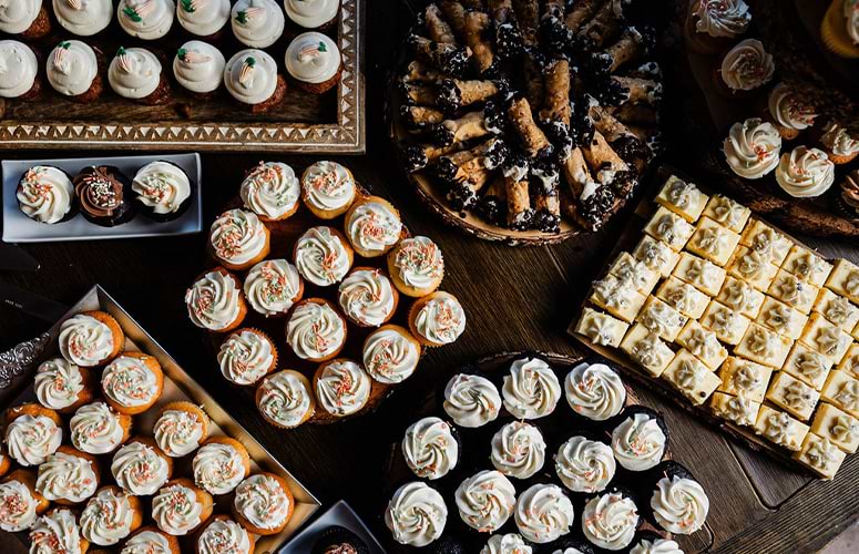 Dessert bar with cupcakes and cannolis - Boulder Creek by Wedgewood Weddings