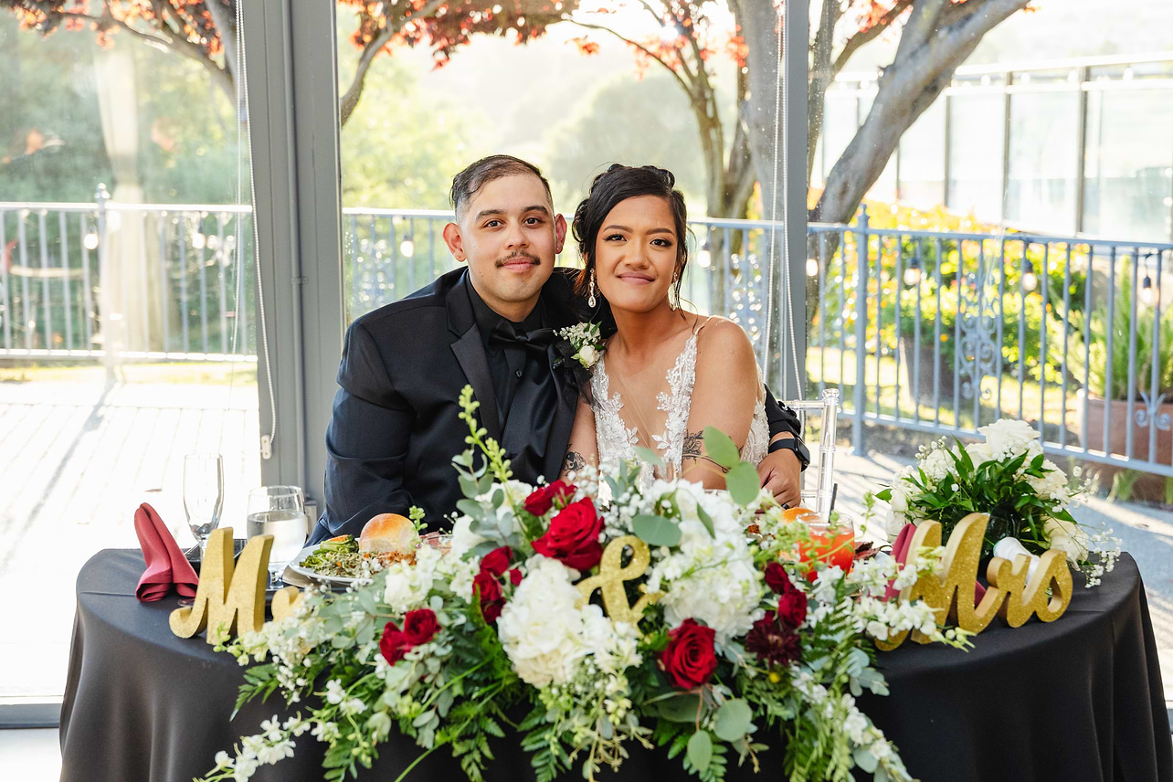 Newlyweds at their sweetheart table - Hiddenbrooke Hills by Wedgewood Weddings