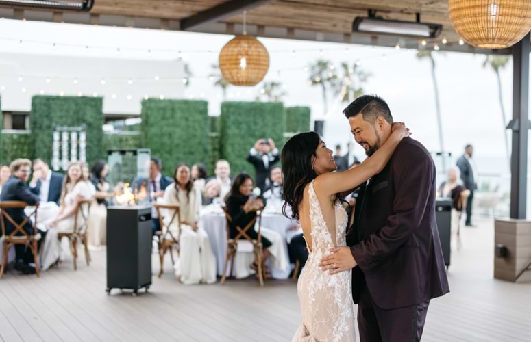 Newlyweds enjoying first dance - La Jolla Cove Rooftop by Wedgewood Weddings - 1