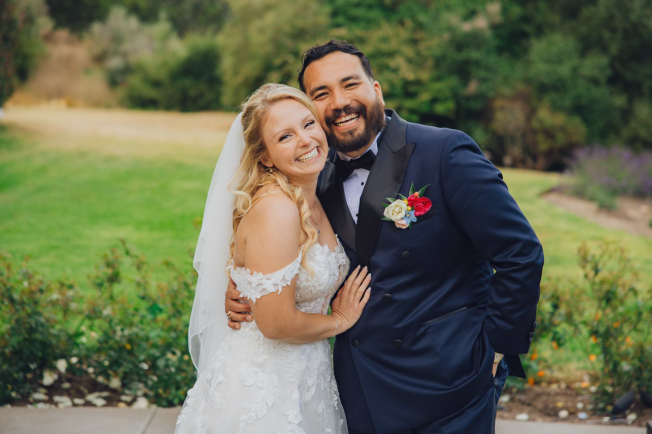 Newlyweds in garden at Carmel Fields by Wedgewood Weddings