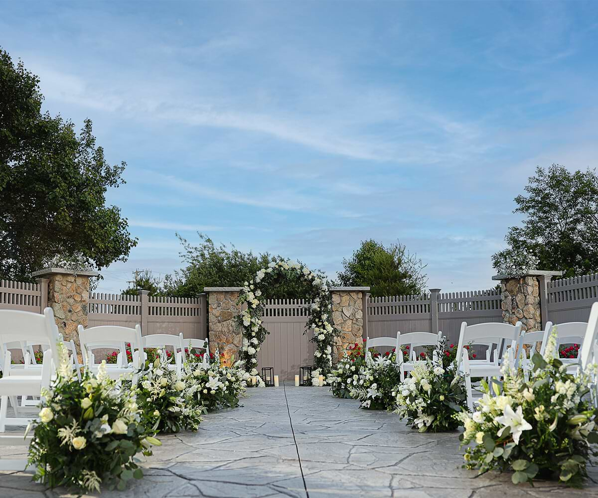 Beautiful Ceremony Site with Florals - Barker House by Wedgewood Weddings