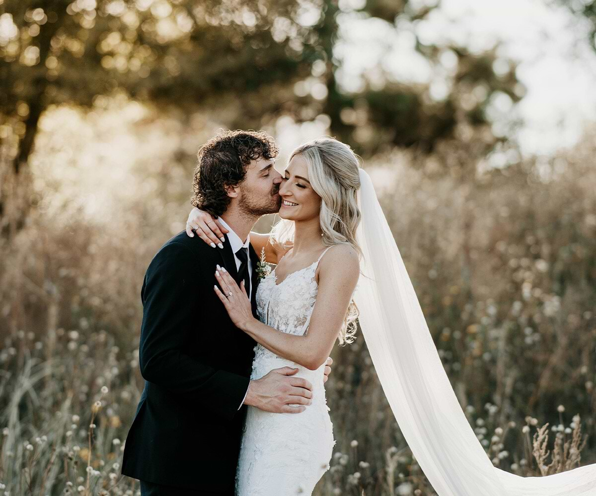 Couple posing in meadow - Creekside Terrace by Wedgewood Weddings