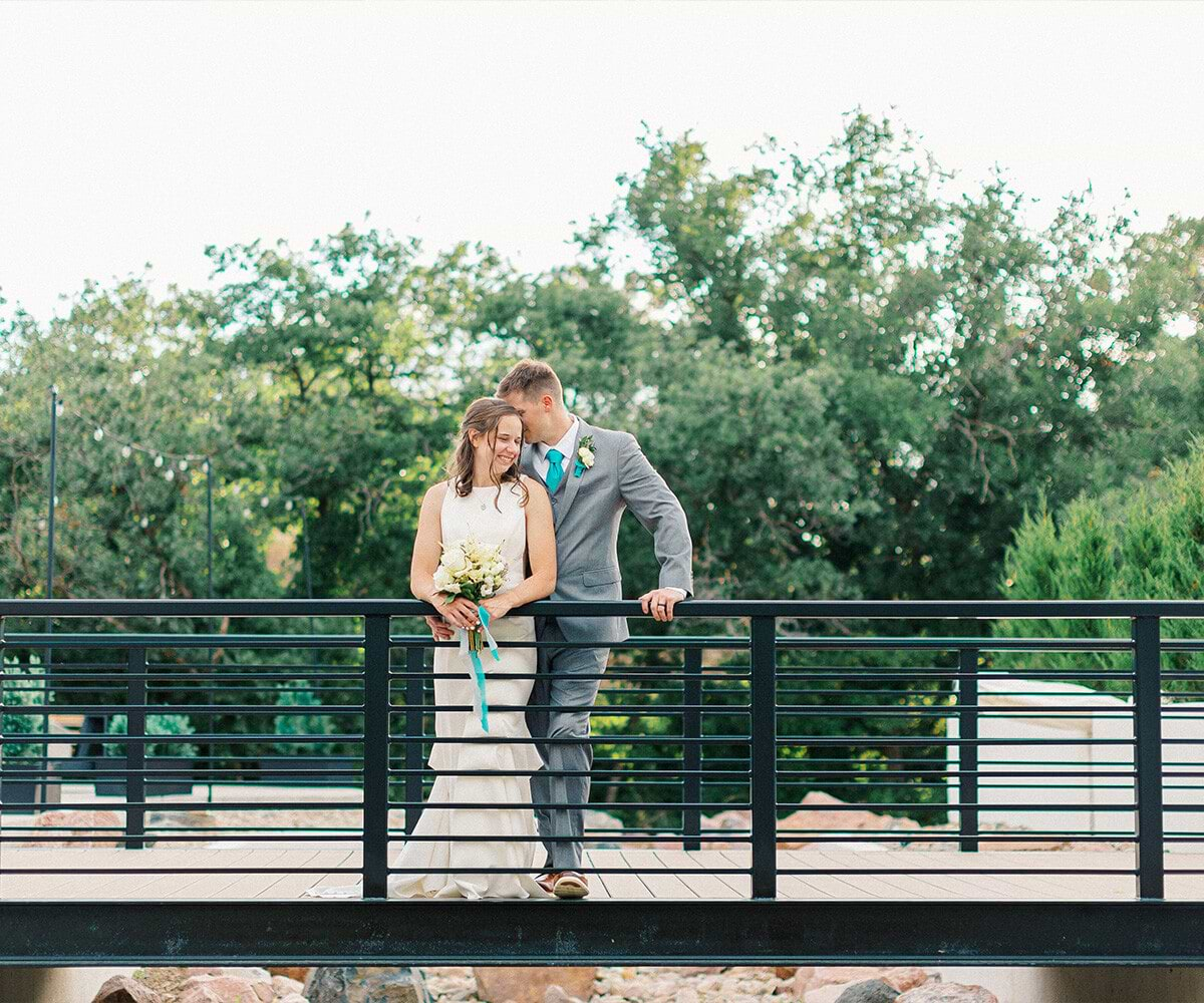 Happy couple on bride at Creekside Terrace by Wedgewood Weddings