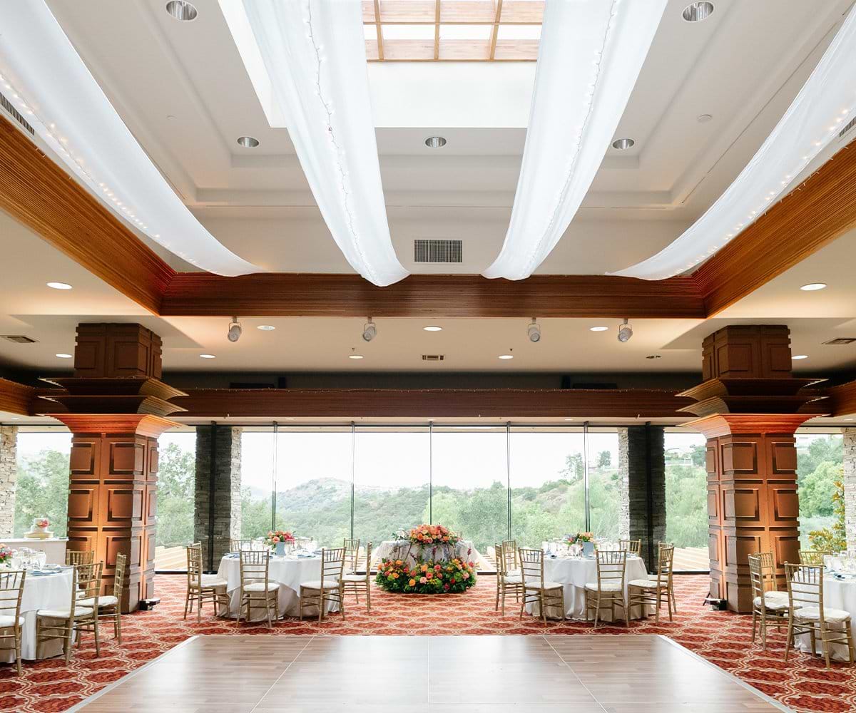 Indoor reception hall at Dove Canyon with large window and high ceilings (6)