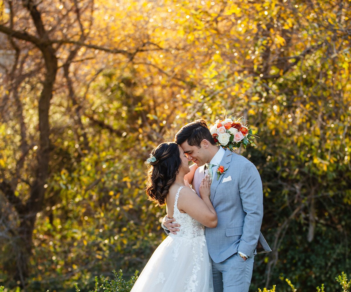 Couple posing among greenery - Hiddenbrooke Hills by Wedgewood Weddings