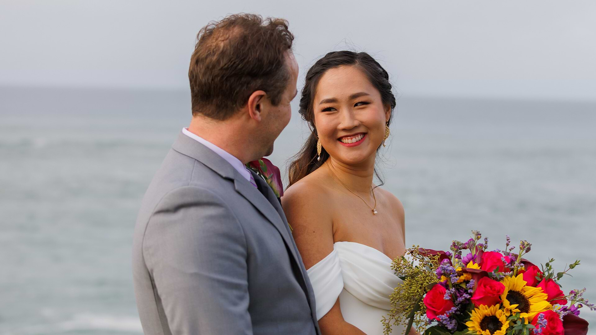 Happy newlyweds with ocean views