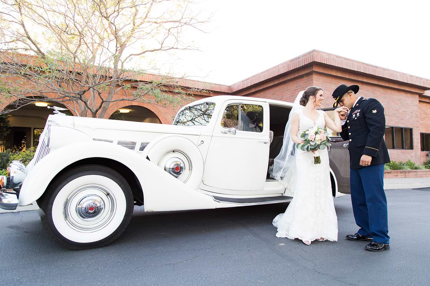 Bride and Groom with a vintage car at Sierra La Verne by Wedgewood Weddings