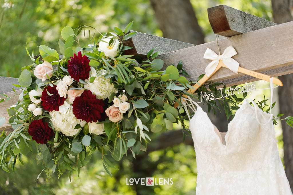 red and white wedding flowers ceremony arch