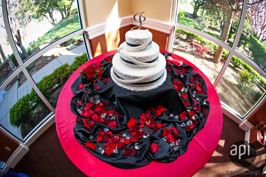 decorated red and black wedding cake table