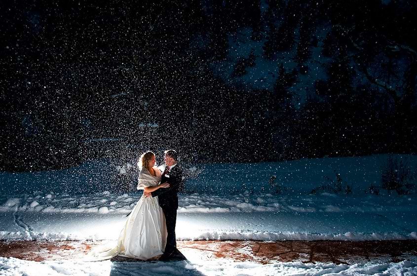 bride and groom in snow at Wedgewood Weddings