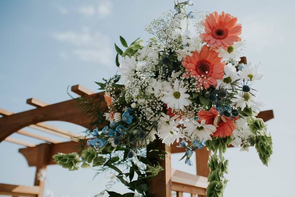 ventura california beach wedding ceremony floral arch
