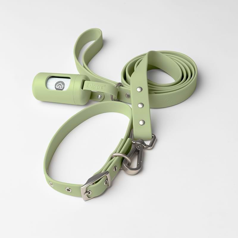 Dog harness with poop bag holder outlet