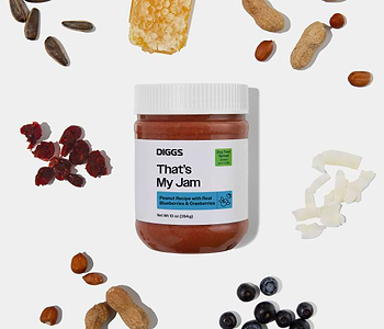 That's My Jam Peanut Butter Treat Spread on white background beside its ingredients (blueberry, cranberry, peanut, etc.) 