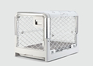 A white dog crate with a door open