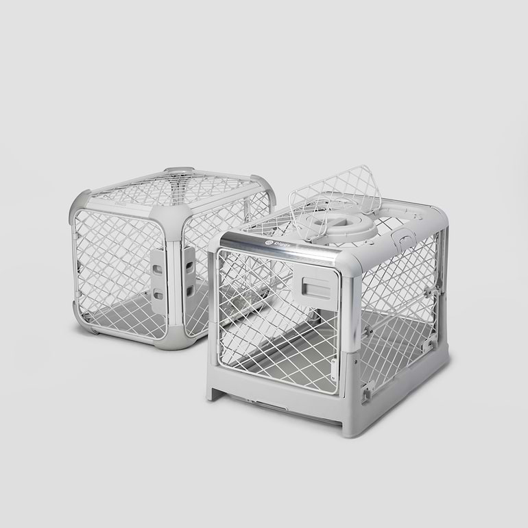 Evolv Revol Side A Revol and an Evolv dog crate sitting next to each other